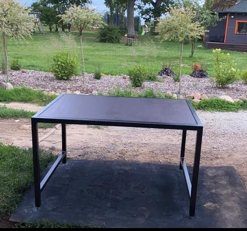 Table with metal frame and a wooden surface